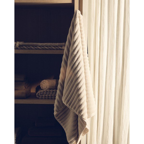 Beež puuvillane froteerätik 50x90 cm Navira - Kave Home-image-1